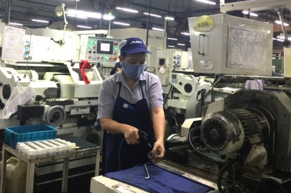 A Juki employee during work hours. Photo by VnExpress/Le Tuyet